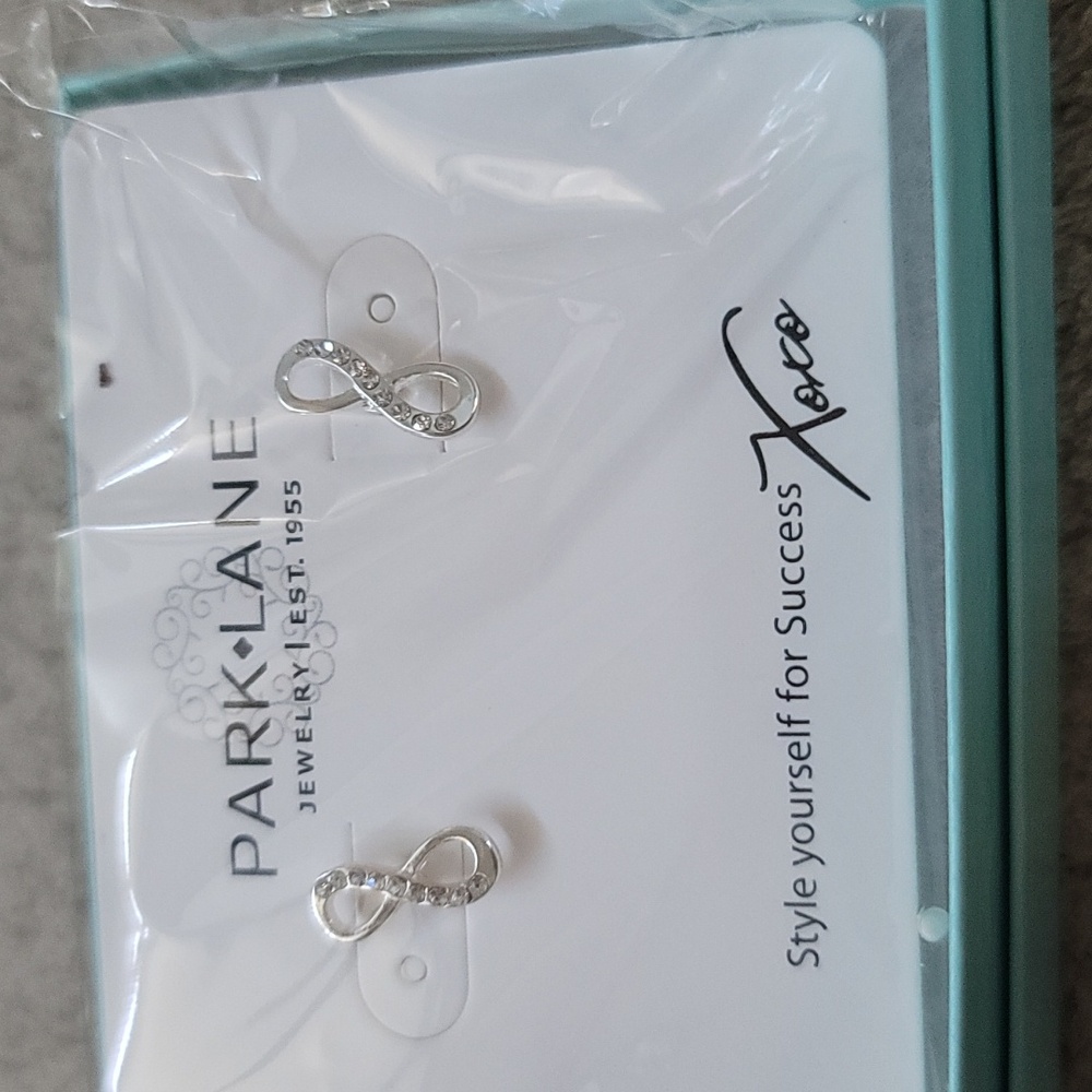Infinity Earrings. Silver in color made by Park Lane.